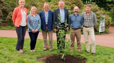 Image of Gerry Saddler and Directorate planting tree at the Royal botanic Gardens Edinburgh