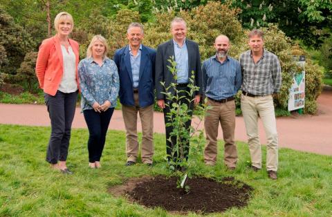 Image of Gerry Saddler and Directorate planting tree at the Royal botanic Gardens Edinburgh