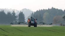 Tractor spraying field